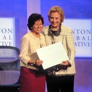 Shelly Esque and Hillary Clinton onstage at the Clinton Global Initiative