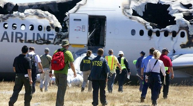 Investigators with the U.S. National Transportation Safety Board (NTSB) at the Asiana flight 214 crash scene at San Francisco International Airport. Three Intel employees, and several of their family 
